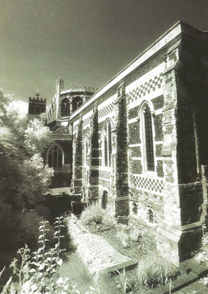 The church of St Bartholomew The Great seen by night.